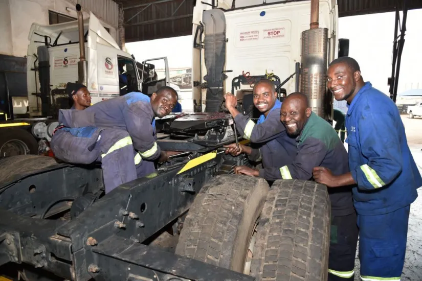 Diesel mechanics course — students diagnosing and repairing diesel vehicle systems in workshop
