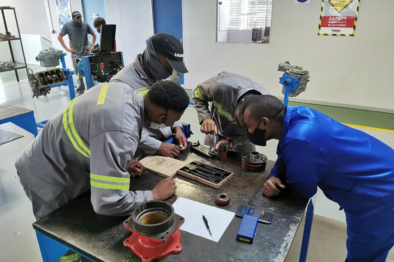 Diesel Mechanics Training School 5 Diesel mechanics students working on engines